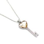 Wholesale Swarovski element heart key necklace: heart-shaped crystal key pendant on a high-quality real gold plated copper chain.
