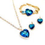Wholesale Swarovski element heart jewelry set including crystal necklace, stud earrings, and bracelet in real gold plated brass.