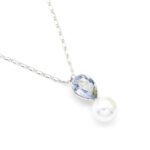 Sparkling Swarovski element teardrop crystal and white pearl pendant necklace in gold and platinum plating for wholesale at junejewelry.com.