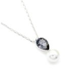 Sparkling Swarovski element teardrop crystal and white pearl pendant necklace in gold and platinum plating for wholesale at junejewelry.com.
