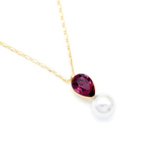 Sparkling Swarovski element teardrop crystal and white pearl pendant necklace in gold and platinum plating for wholesale at junejewelry.com.