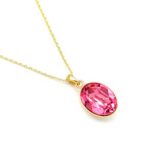 Dainty oval Swarovski element crystal necklace in gold and white gold plated copper for fashion jewelry wholesale from junejewelry.com.
