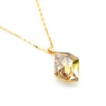 Unique Swarovski element irregular shaped single crystal pendant necklace with real gold plating for fashion jewelry wholesale at junejewelry.com.