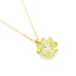 Elegant snowflake shaped Swarovski element single crystal pendant necklace in gold and white gold plating for wholesale at junejewelry.com.