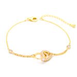 Wholesale copper zircon bracelet with 18K gold plating and shimmering heart charms from JuneJewelry.com – luxury fashion jewelry for bulk orders.
