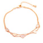 Wholesale copper zircon bracelet with rose gold plating and heart charms from JuneJewelry.com – luxury fashion jewelry for bulk orders.