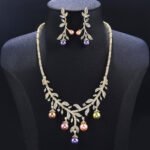 Wholesale pearl zircon set featuring a leaf-inspired necklace and earrings with colorful shell pearls and real gold plated copper from JuneJewelry.com.