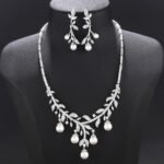 Wholesale pearl zircon set featuring a leaf-inspired necklace and earrings with colorful shell pearls and real gold plated copper from JuneJewelry.com.