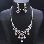 Wholesale pearl zircon set featuring a leaf-inspired necklace and earrings with colorful shell pearls and real gold plated copper from JuneJewelry.com.