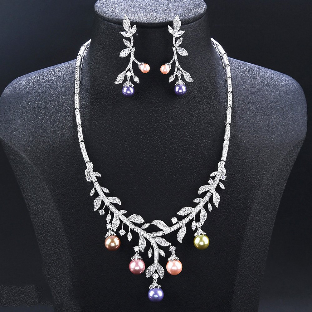 Wholesale pearl zircon set featuring a leaf-inspired necklace and earrings with colorful shell pearls and real gold plated copper from JuneJewelry.com.
