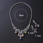 Wholesale pearl zircon set featuring a leaf-inspired necklace and earrings with colorful shell pearls and real gold plated copper from JuneJewelry.com.