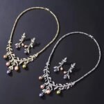 Wholesale pearl zircon set featuring a leaf-inspired necklace and earrings with colorful shell pearls and real gold plated copper from JuneJewelry.com.