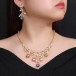 Wholesale pearl zircon set featuring a leaf-inspired necklace and earrings with colorful shell pearls and real gold plated copper from JuneJewelry.com.
