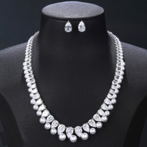 Wholesale teardrop pearl set with pear-cut zircons and white shell pearls on gold plated copper from JuneJewelry.com – bridal jewelry for bulk orders.