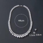 Wholesale teardrop pearl set with pear-cut zircons and white shell pearls on gold plated copper from JuneJewelry.com – bridal jewelry for bulk orders.