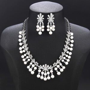 Wholesale fan pearl set featuring a sunburst necklace and earrings with white shell pearls and gold plated copper from JuneJewelry.com.