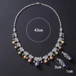 Wholesale floral pearl set with gold plated copper and colorful shell pearls from JuneJewelry.com – unique botanical bridal jewelry for bulk purchase.