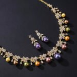 Wholesale floral pearl set with gold plated copper and colorful shell pearls from JuneJewelry.com – unique botanical bridal jewelry for bulk purchase.