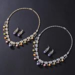 Wholesale floral pearl set with gold plated copper and colorful shell pearls from JuneJewelry.com – unique botanical bridal jewelry for bulk purchase.