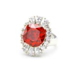 Wholesale red zircon ring with a large cushion-cut stone and white gold plated copper band from JuneJewelry.com – adjustable luxury jewelry for bulk buyers.