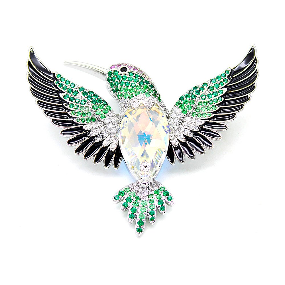 Wholesale hummingbird crystal brooch with green stones and black enamel on platinum plated copper from JuneJewelry.com – unique bird jewelry for bulk orders.