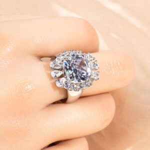 Wholesale red zircon ring with a large cushion-cut stone and white gold plated copper band from JuneJewelry.com – adjustable luxury jewelry for bulk buyers.