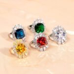 Wholesale red zircon ring with a large cushion-cut stone and white gold plated copper band from JuneJewelry.com – adjustable luxury jewelry for bulk buyers.