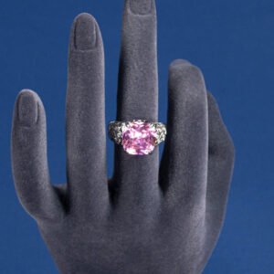 Wholesale pink zircon ring with a large cushion-cut stone on platinum plated copper from JuneJewelry.com – adjustable feminine jewelry for bulk orders.