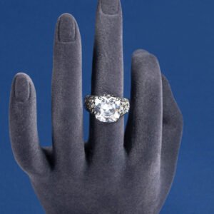 Wholesale pink zircon ring with a large cushion-cut stone on platinum plated copper from JuneJewelry.com – adjustable feminine jewelry for bulk orders.