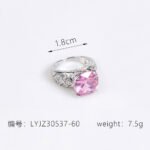 Wholesale pink zircon ring with a large cushion-cut stone on platinum plated copper from JuneJewelry.com – adjustable feminine jewelry for bulk orders.