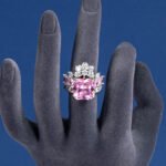 Wholesale pink square ring featuring a large princess-cut zircon on a gold-plated adjustable copper band from JuneJewelry.com for jewelry wholesalers.