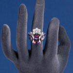 Wholesale pink square ring featuring a large princess-cut zircon on a gold-plated adjustable copper band from JuneJewelry.com for jewelry wholesalers.