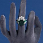 Wholesale pink square ring featuring a large princess-cut zircon on a gold-plated adjustable copper band from JuneJewelry.com for jewelry wholesalers.