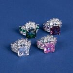 Wholesale pink square ring featuring a large princess-cut zircon on a gold-plated adjustable copper band from JuneJewelry.com for jewelry wholesalers.