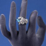 Wholesale leopard zircon ring with 18K gold plated copper and a red oval stone from JuneJewelry.com – adjustable animal jewelry for bulk orders.