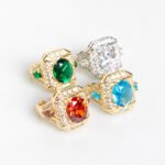 Wholesale adjustable zircon ring with real gold plating on copper from JuneJewelry.com – open band fashion jewelry for bulk orders.