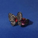 Wholesale butterfly open ring with pink zircon stones and real gold plating on copper from JuneJewelry.com – adjustable fashion ring for bulk orders.