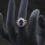 Wholesale luxury zircon ring featuring a large red oval stone on gold plated copper from JuneJewelry.com – adjustable high-quality jewelry for bulk buyers.