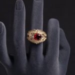 Wholesale ruby zircon ring with 18K gold plated copper and cushion-cut red stone from JuneJewelry.com – luxury adjustable jewelry for bulk orders.