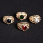 Wholesale ruby zircon ring with 18K gold plated copper and cushion-cut red stone from JuneJewelry.com – luxury adjustable jewelry for bulk orders.