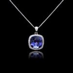 Wholesale cushion crystal necklace with a deep blue Swarovski Elements stone and halo pendant on platinum plated copper from JuneJewelry.com.