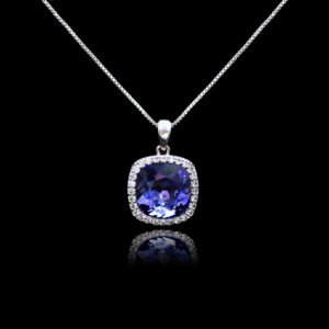 Wholesale cushion crystal necklace with a deep blue Swarovski Elements stone and halo pendant on platinum plated copper from JuneJewelry.com.
