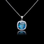 Wholesale cushion crystal necklace with a deep blue Swarovski Elements stone and halo pendant on platinum plated copper from JuneJewelry.com.