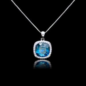 Wholesale cushion crystal necklace with a deep blue Swarovski Elements stone and halo pendant on platinum plated copper from JuneJewelry.com.