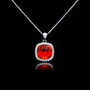 Wholesale cushion crystal necklace with a deep blue Swarovski Elements stone and halo pendant on platinum plated copper from JuneJewelry.com.