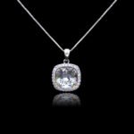 Wholesale cushion crystal necklace with a deep blue Swarovski Elements stone and halo pendant on platinum plated copper from JuneJewelry.com.
