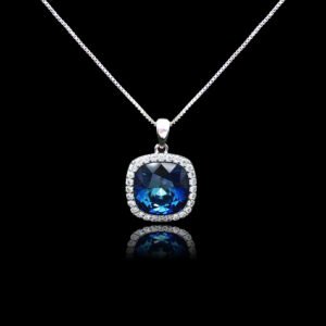 Wholesale cushion crystal necklace with a deep blue Swarovski Elements stone and halo pendant on platinum plated copper from JuneJewelry.com.
