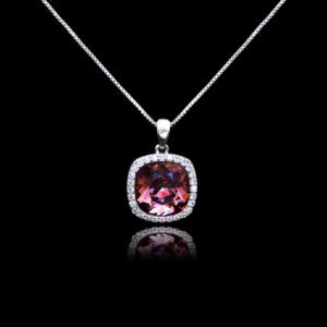 Wholesale cushion crystal necklace with a deep blue Swarovski Elements stone and halo pendant on platinum plated copper from JuneJewelry.com.