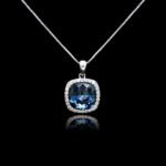 Wholesale cushion crystal necklace with a deep blue Swarovski Elements stone and halo pendant on platinum plated copper from JuneJewelry.com.