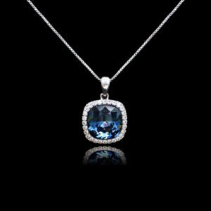 Wholesale cushion crystal necklace with a deep blue Swarovski Elements stone and halo pendant on platinum plated copper from JuneJewelry.com.